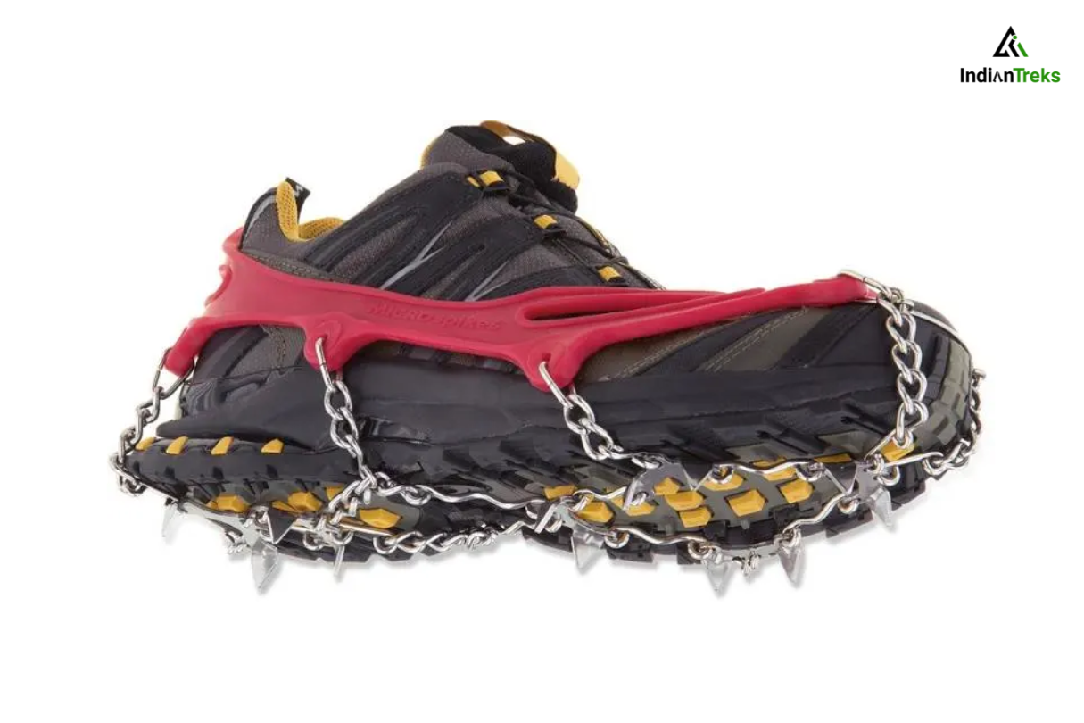 Trekker walking on icy path with microspikes